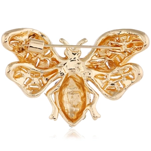 Detailed back view of golden bee brooch showing pin fastener and hollow wing craftsmanship