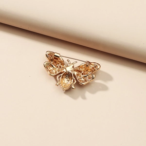 Vintage gold bee brooch with hollow wings and secure safety pin clasp closure