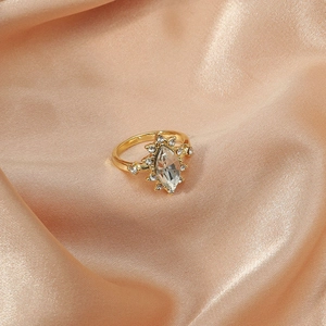 Vintage gold-plated geometric ring with marquise crystal on orange silk background