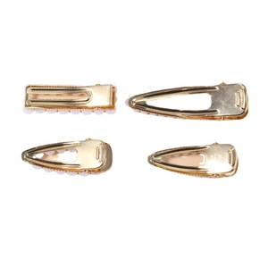 Set of four gold pearl hair clips with durable spring clips on a white background