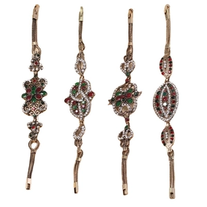 Set mit vier Vintage-Armbändern mit roten und grünen Edelsteinen im Retro-Bronze-Stil