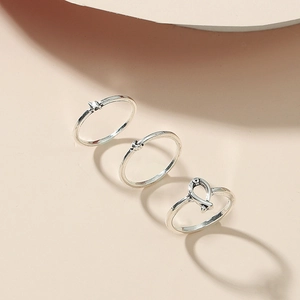 Three-piece geometric alloy toe ring set featuring cat ear and twisted knot designs