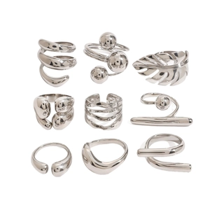 Nine-piece set of silver stainless steel geometric rings with minimalist polished finishes