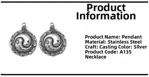 Detailed macro view of a vintage stainless steel Tai Chi Yin Yang pendant with flame edges