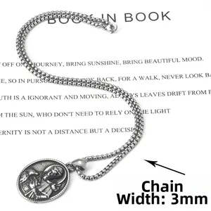 Detail of 3mm box chain and oval religious portrait pendant in silver finish