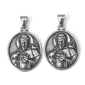 Detailed close-up of retro stainless steel relief pendant showing Saint Francis religious icon