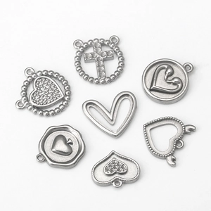 Set of seven silver stainless steel heart and cross charms for DIY jewelry making