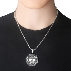 Detailed close-up of a stainless steel Tree of Life pendant with Nordic runes on a chain