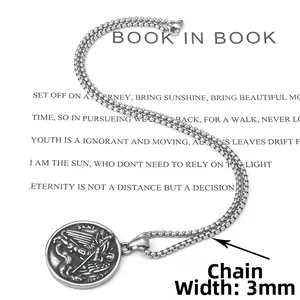 Macro detail of vintage Saint Michael archangel pendant with 3mm stainless steel chain