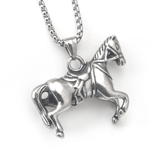 Macro shot of vintage stainless steel horse pendant with retro silver finish on square chain