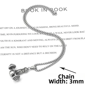 Detail shot of stainless steel dumbbell pendant on a 3mm square box chain necklace