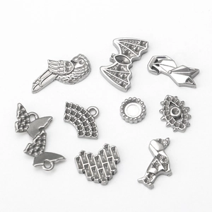 Assorted stainless steel DIY charms featuring animal shapes and geometric patterns on white