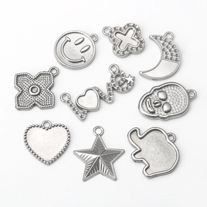 Selection of stainless steel DIY charms with moon, star, and heart shapes for jewelry making
