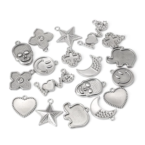 Assorted silver stainless steel DIY pendants including heart, star, and moon shapes
