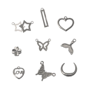 Lot de neuf pendentifs en acier inoxydable pour bijoux DIY avec formes cœur, étoile et papillon