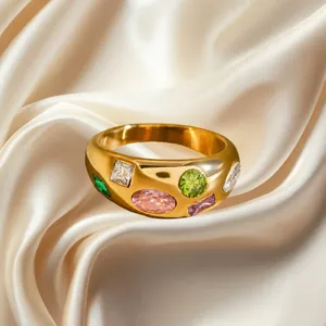 18k gold plated stainless steel wide ring with colorful cubic zirconia on silk background