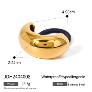 Golden stainless steel ponytail hair cuff with black elastic tie and polished finish