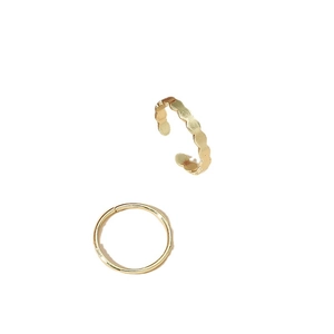 Minimalist gold band set with a smooth ring and a textured open-wave toe ring