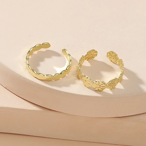 Minimalist adjustable golden ring set featuring daisy floral and wave designs for women