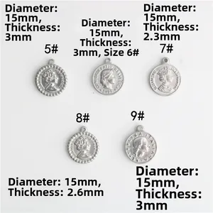 Detail view of 15mm vintage stainless steel coin pendants with queen portraits