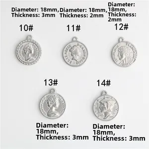 Macro shot of 18mm stainless steel coin charms with detailed queen portrait engraving