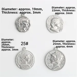 Detailed view of four stainless steel queen coin pendants in different sizes for DIY jewelry