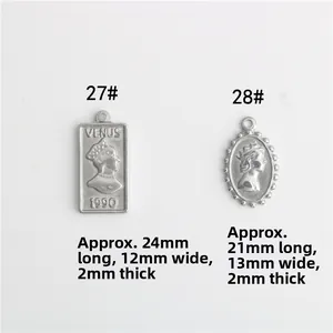 Macro detail of stainless steel Venus coin pendants with precise dimensions and relief pattern