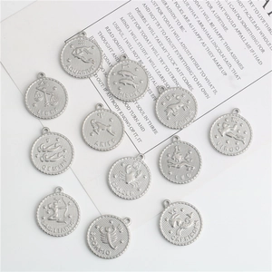 Polished silver stainless steel zodiac charms featuring twelve astrological constellations