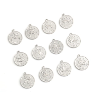 Set of 12 zodiac pendant charms in stainless steel with vintage coin style and engraving