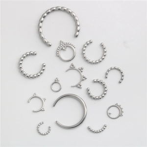 Polished silver stainless steel body jewelry set including nose rings and septum hoops