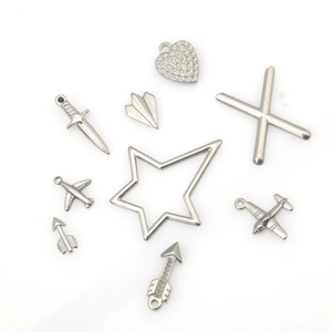 Assortment of silver punk stainless steel DIY charms including heart plane and star shapes