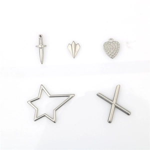 Set of stainless steel punk charms featuring dagger, heart, star and letter X pendants