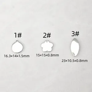Macro shot of stainless steel round, flower and oval pendants for jewelry DIY