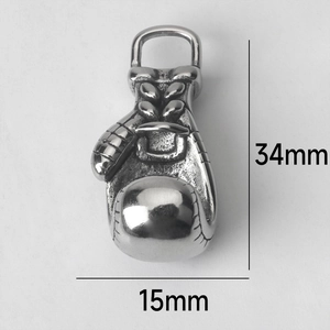 Detailed view of 34mm stainless steel boxing glove pendant with vintage texture