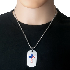 Detail of cross pendant necklace with American flag patterns on a silver chain