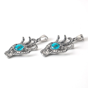 Colgante de garra de dragón retro en acero inoxidable con ojo azul para joyería DIY