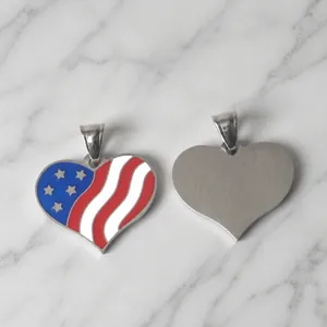 Macro detail of heart-shaped stainless steel pendant with US flag pattern and brushed back