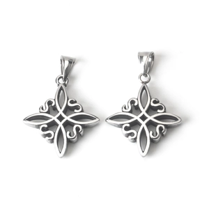 Detailed macro view of polished stainless steel Celtic knot pendants with intricate symmetry