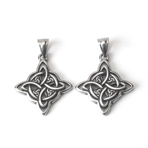 Macro detail of retro stainless steel Celtic Witch's Knot pendants with oxidized finish