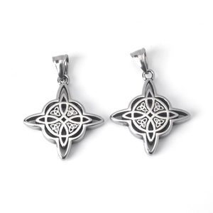 Macro shot of silver stainless steel Celtic witch knot pendants with vintage engraving details