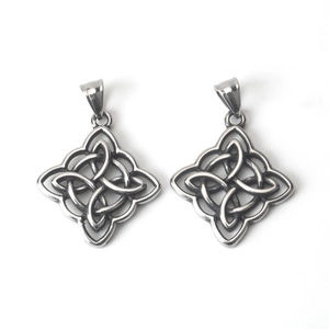 Close-up of dual Celtic knot stainless steel pendants with polished bails on white background