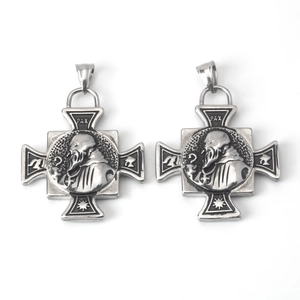 Detailed relief of vintage stainless steel Pax cross pendant with saint portrait