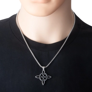 Close-up of a silver stainless steel Celtic Witch's Knot pendant worn on a black shirt