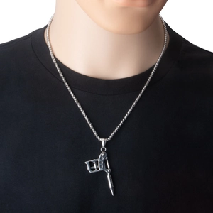Detailed view of punk style stainless steel tattoo machine pendant necklace on a model