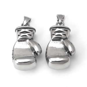 Polished stainless steel boxing glove pendants with engraved wrist detailing on white backdrop