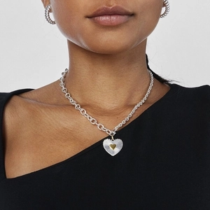 Silver steel heart necklace set with gold heart pendant and ribbed hoop earrings