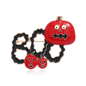 Halloween enamel brooch featuring black BOO lettering and red pumpkin faces on metal