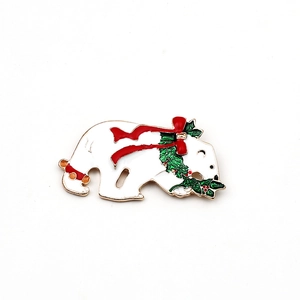 Christmas polar bear brooch with enamel holly wreath and red ribbon on gold plating