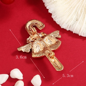 Broche dorée cloche et canne de Noël avec émail rouge et épingle de fixation au dos