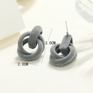 Detail view of interlocking grey flocked earrings measuring 3.0 cm height and 2.0 cm width